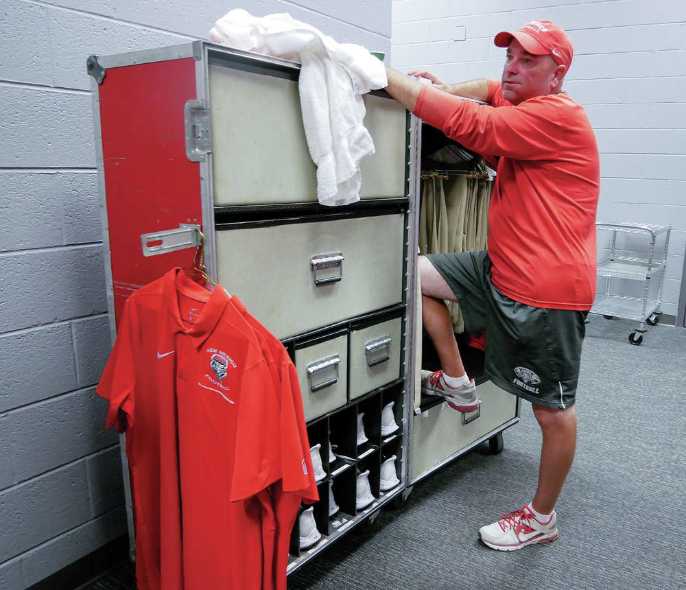 Small army of movers gets Lobos’ gear on road